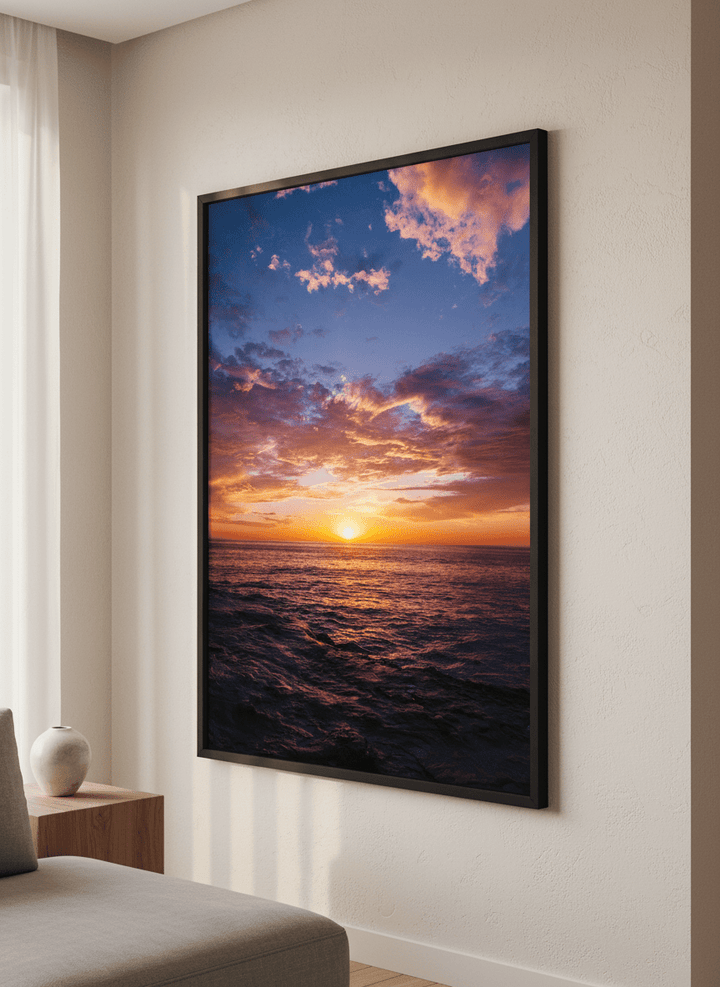 Modern wall art styled above a sofa in a neutral living room