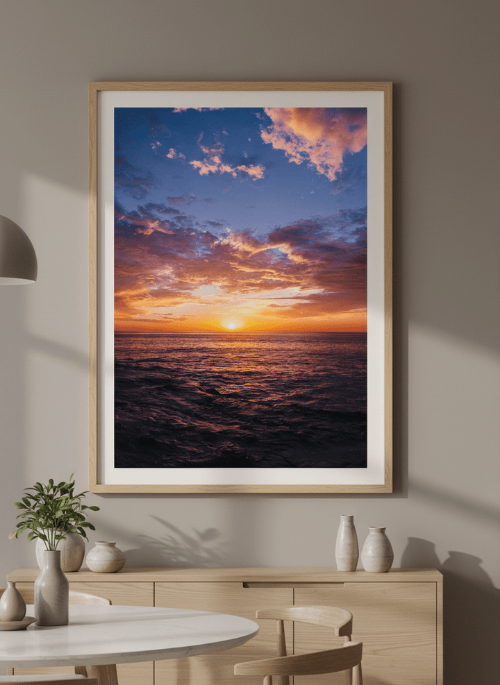 Wall art styled above a dining table in a contemporary home