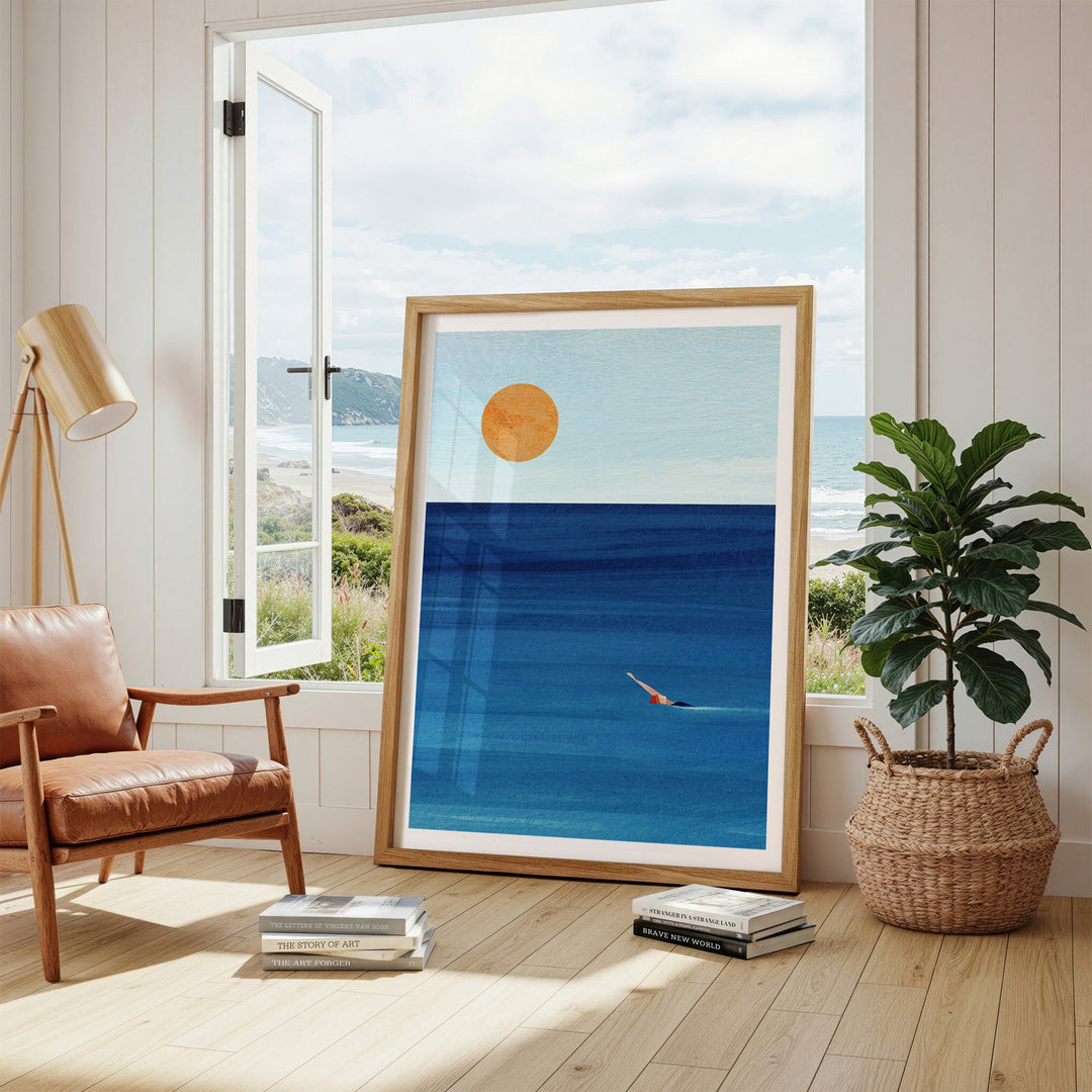 Artwork of a beach scene with a swimmer in a living room.