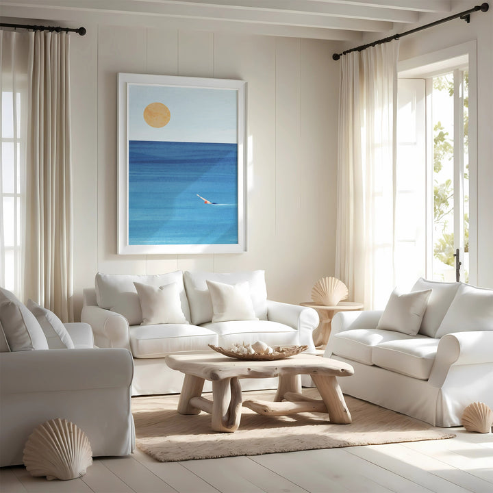 Modern living room with white furniture, a wooden coffee table, and a beach-themed wall art.