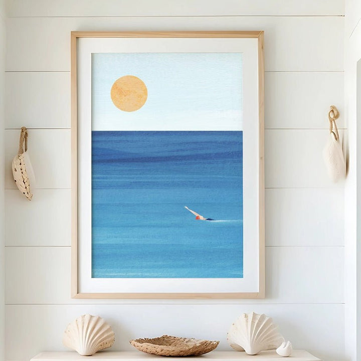 Nautical-themed interior with a seascape painting, shell decor, and a woven basket.