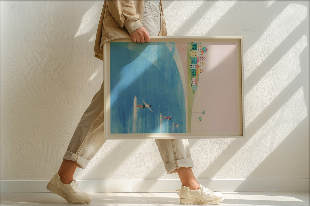 Person holding an artwork with a cityscape and blue sky.
