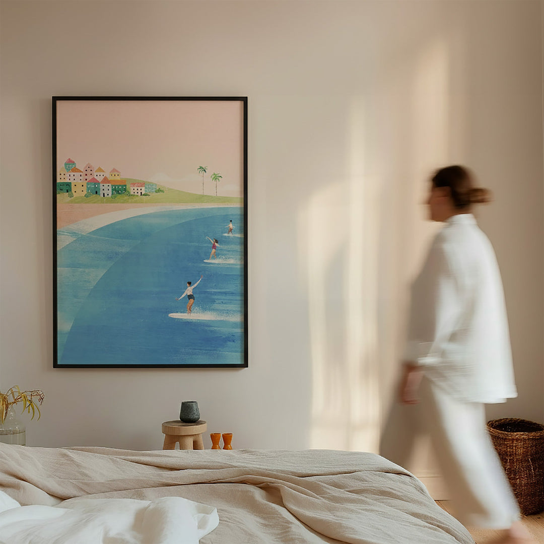 Artwork of a beach scene on a wall with a person walking by.