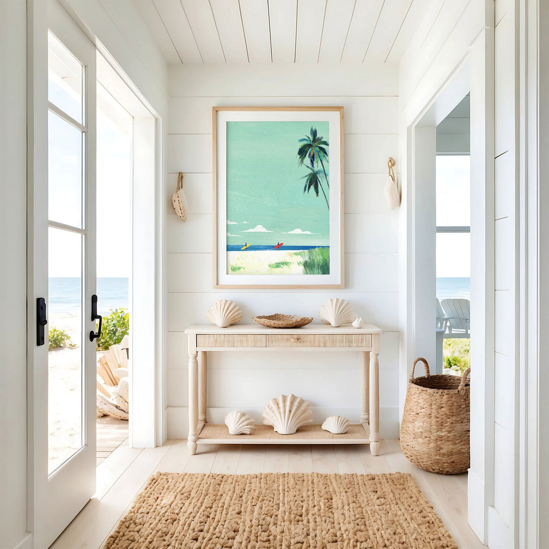 Nautical-themed interior with a console table, shell decor, and a beach-themed wall art.