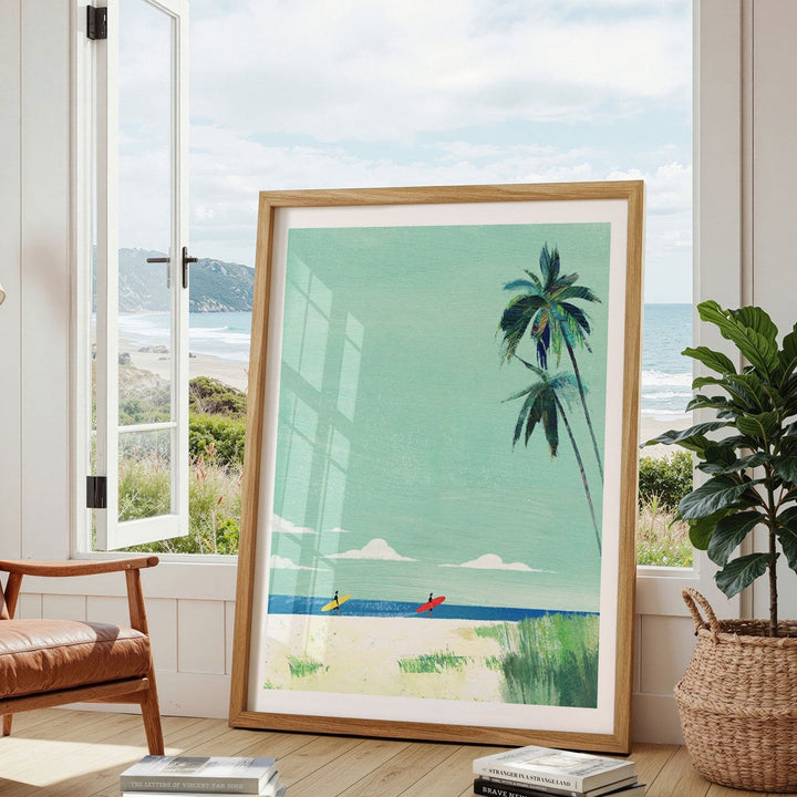 Artwork of a beach scene with palm trees in a living room.