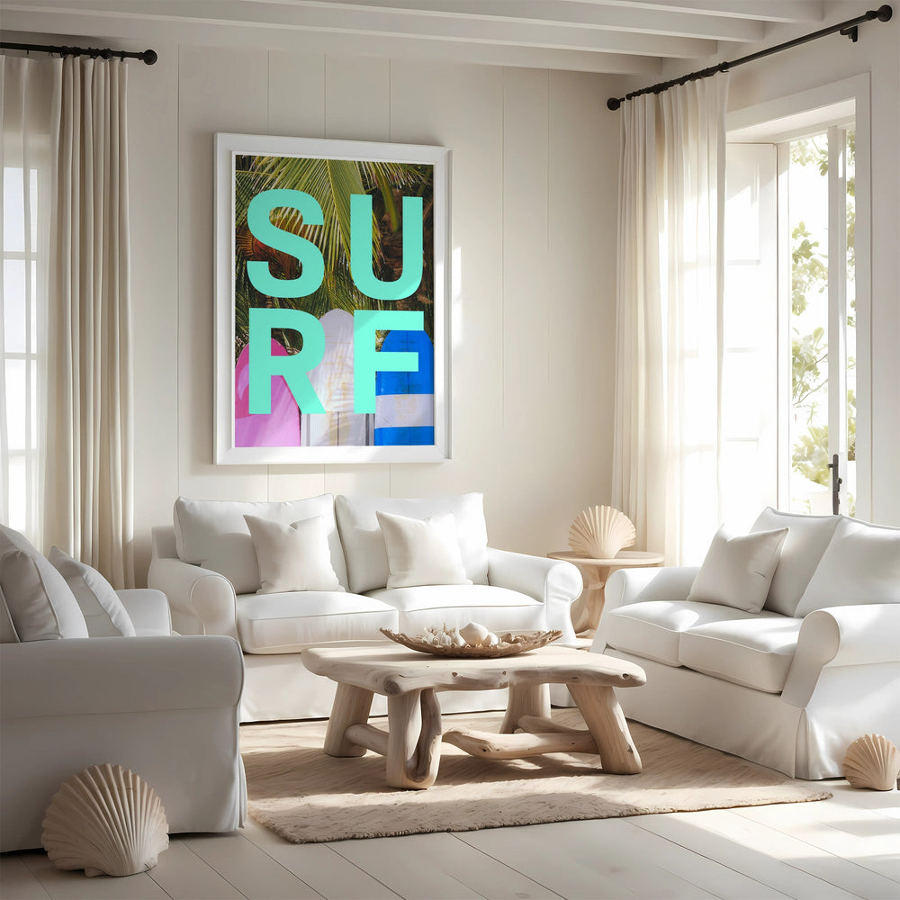 Modern living room with white furniture, a wooden coffee table, and a colorful 'SURE' art print on the wall.