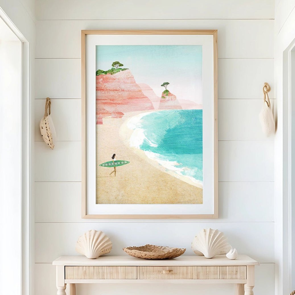 Nautical-themed interior with a beach scene painting on the wall, shell decor, and a woven basket.