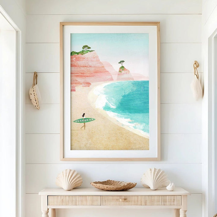Nautical-themed interior with a beach scene painting on the wall, shell decor, and a woven basket.