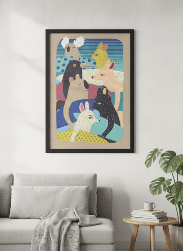 Modern wall art styled above a sofa in a neutral living room