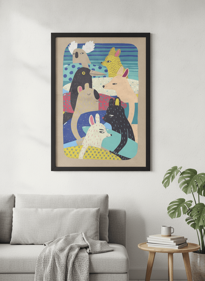 Modern wall art styled above a sofa in a neutral living room