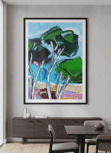 Wall art styled above a dining table in a contemporary home