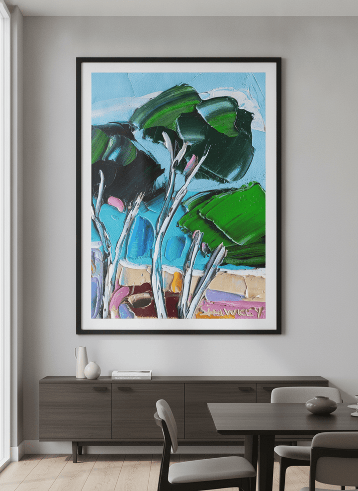 Wall art styled above a dining table in a contemporary home