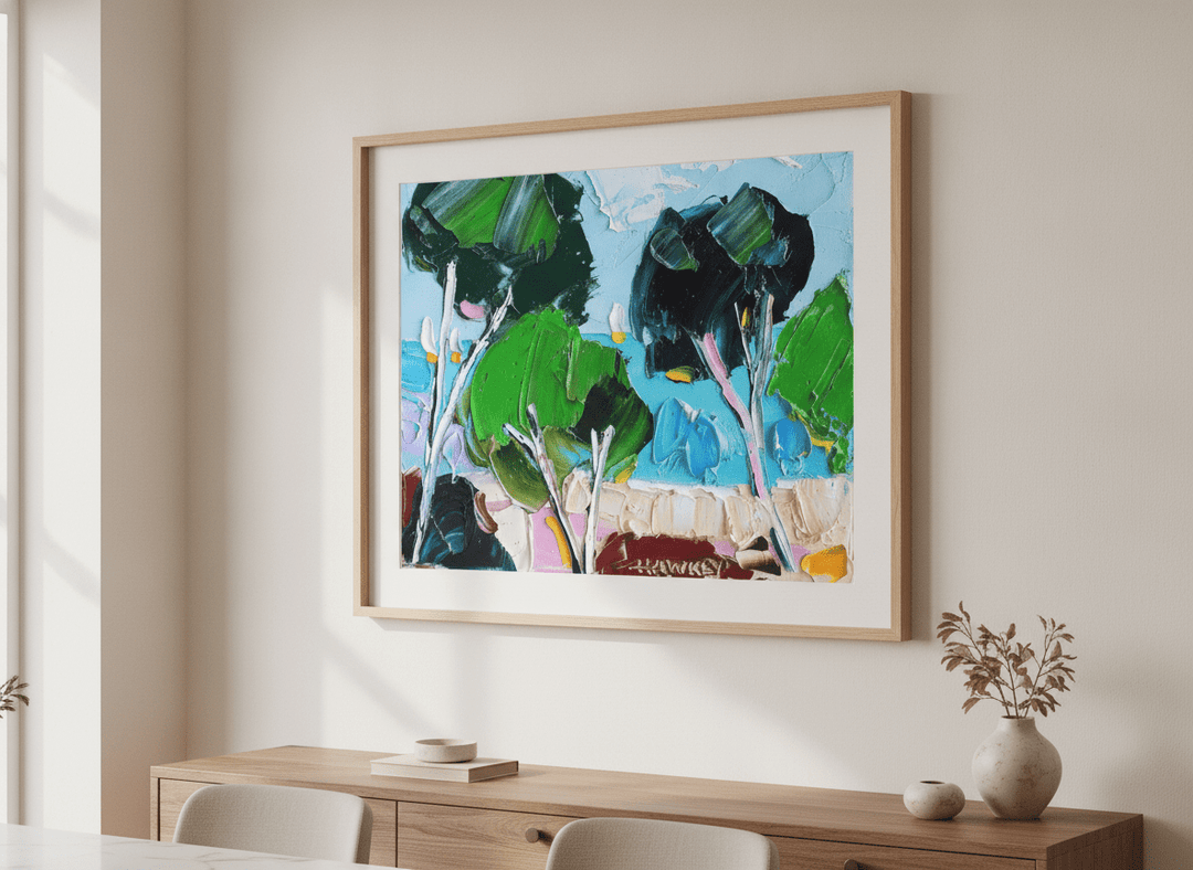 Wall art styled above a dining table in a contemporary home