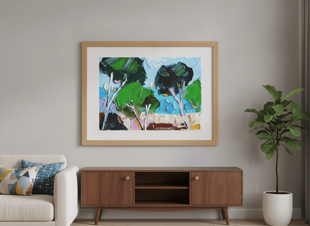 Modern wall art styled above a sofa in a neutral living room