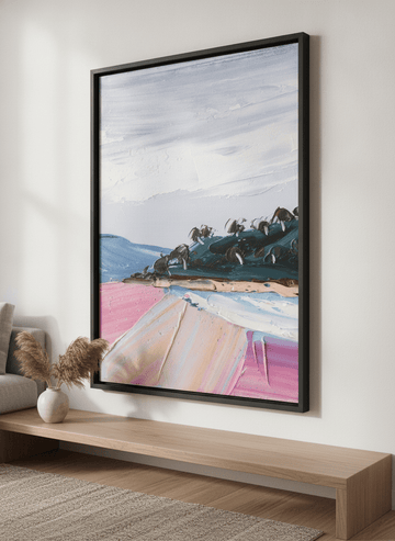Modern wall art styled above a sofa in a neutral living room