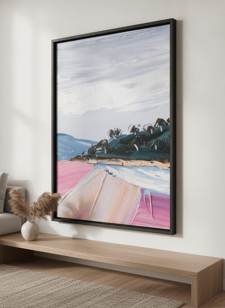 Modern wall art styled above a sofa in a neutral living room