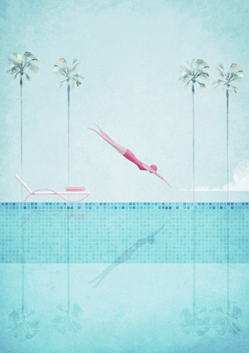 Two pink diving boards on a pool deck with palm trees in the background. framed