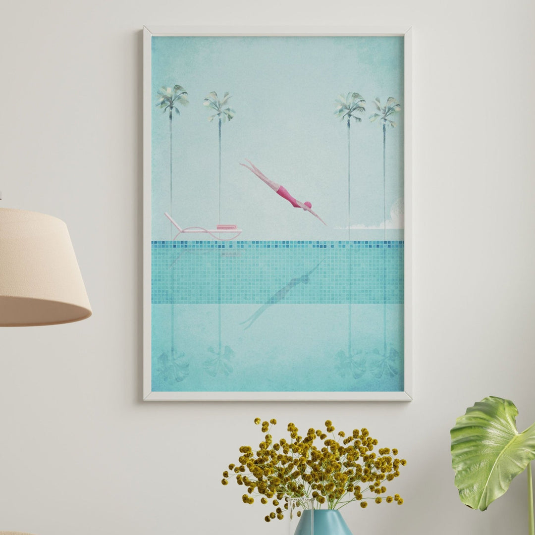 Living room with a beige armchair, lamp, and decorative items on a side table.