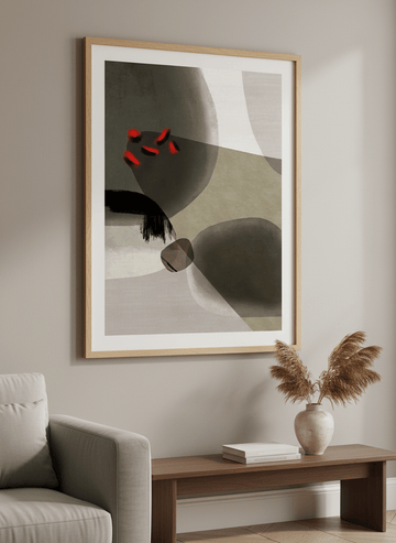 Modern wall art styled above a sofa in a neutral living room
