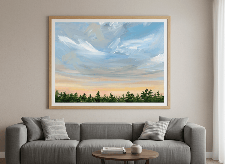 Modern wall art styled above a sofa in a neutral living room