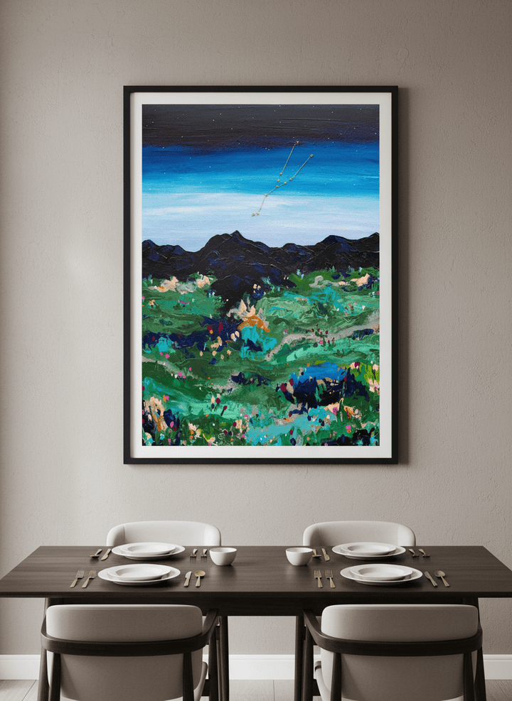 Wall art styled above a dining table in a contemporary home