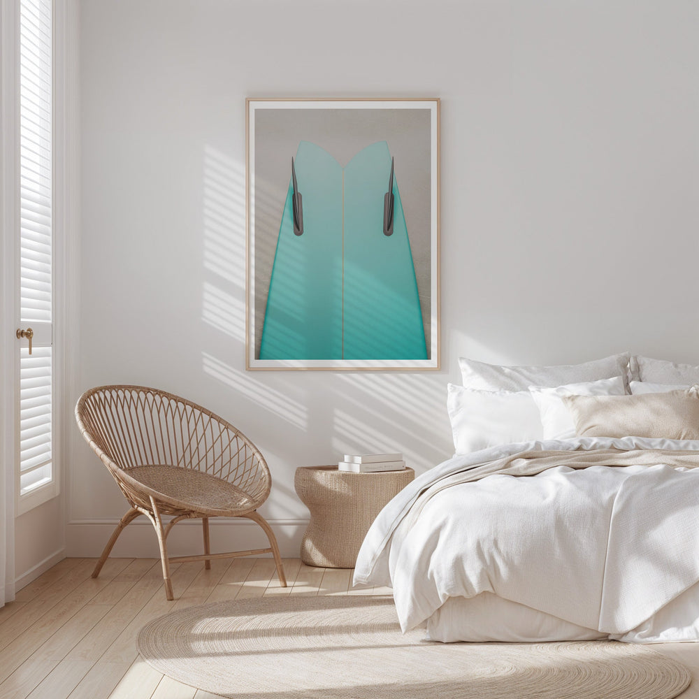 Modern bedroom with a bed, chair, and artwork on the wall.