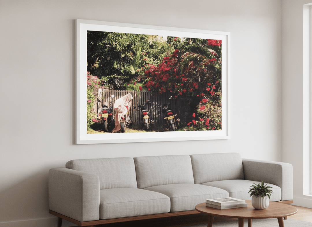 Modern wall art styled above a sofa in a neutral living room