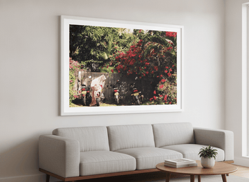 Modern wall art styled above a sofa in a neutral living room