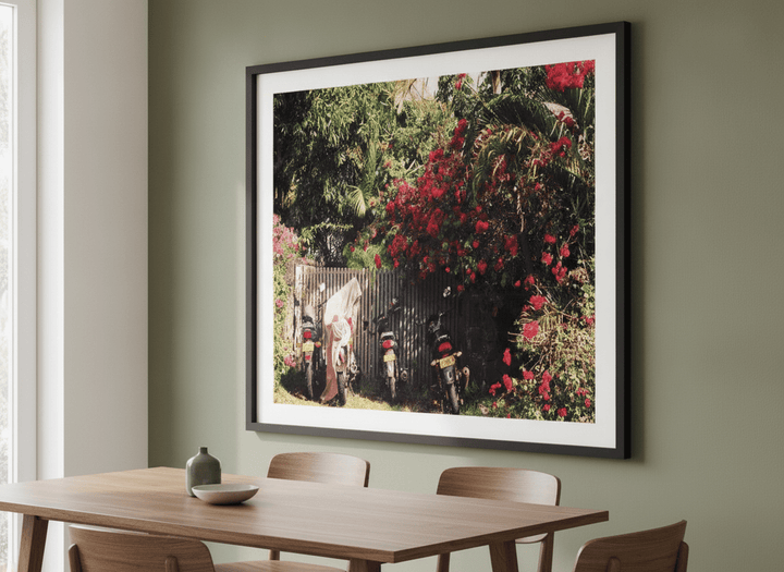 Wall art styled above a dining table in a contemporary home