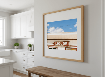 Artwork styled on the wall of a bright modern kitchen