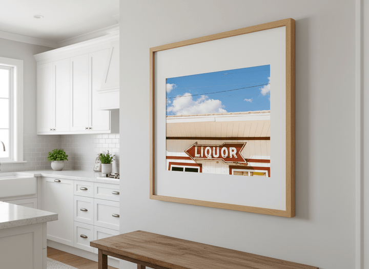 Artwork styled on the wall of a bright modern kitchen