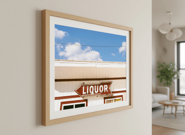 Modern wall art styled above a sofa in a neutral living room