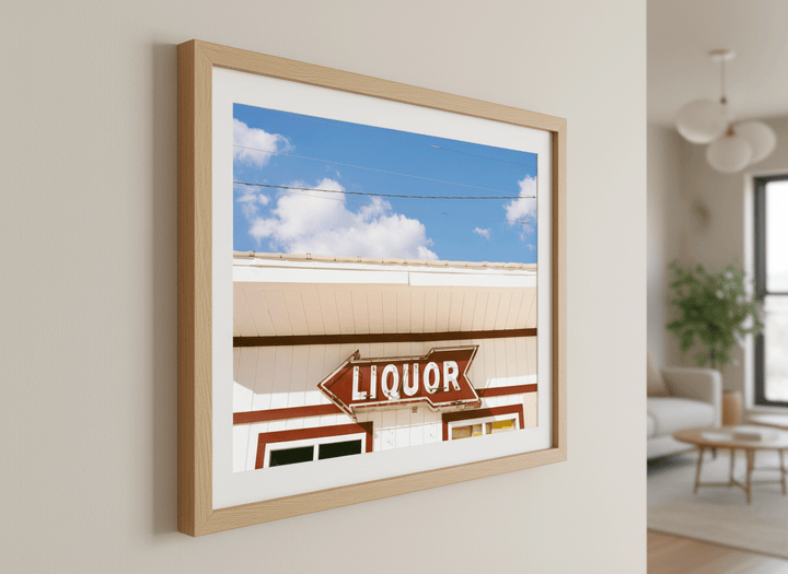Modern wall art styled above a sofa in a neutral living room