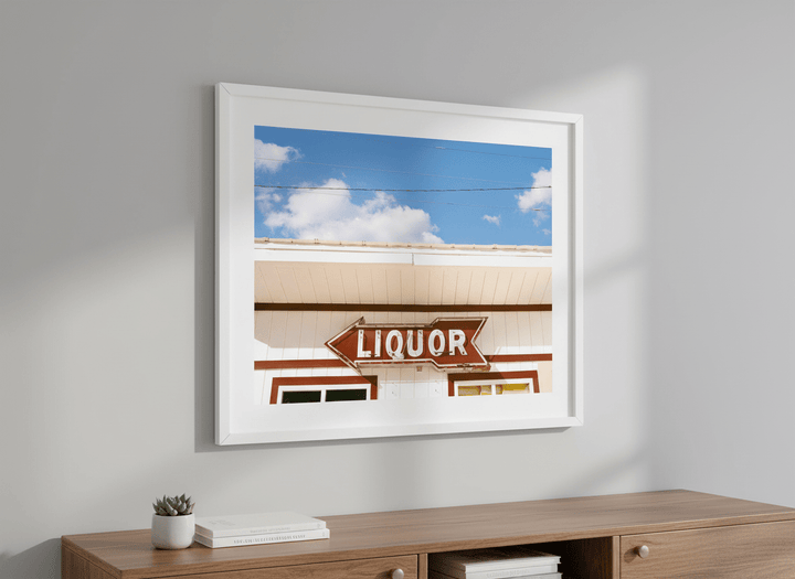 Modern wall art styled above a sofa in a neutral living room
