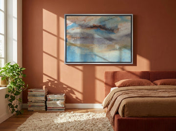 Canvas wall art with a silver leaf surround styled on the wall in a retro 70s bedroom
