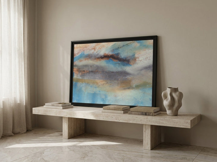 Modern wall art print standing on a console in a luxe living room