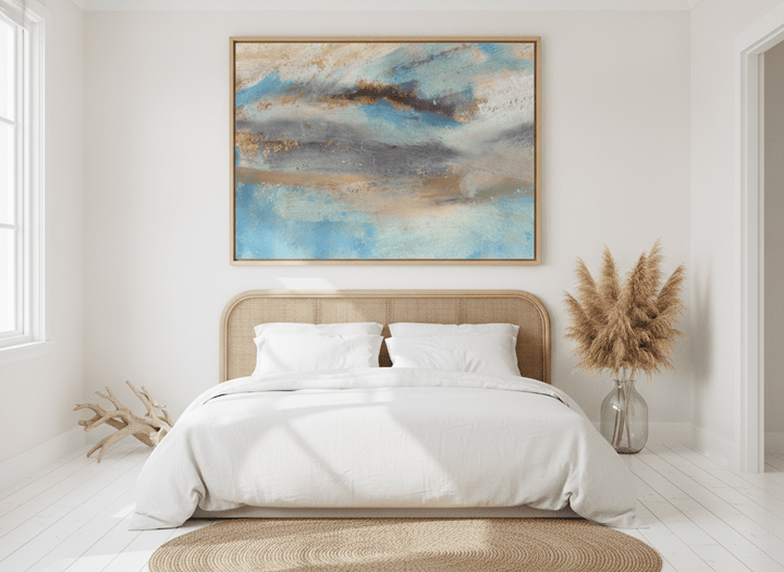 Oversized statement modern wall art print styled on the wall in a coastal bedroom
