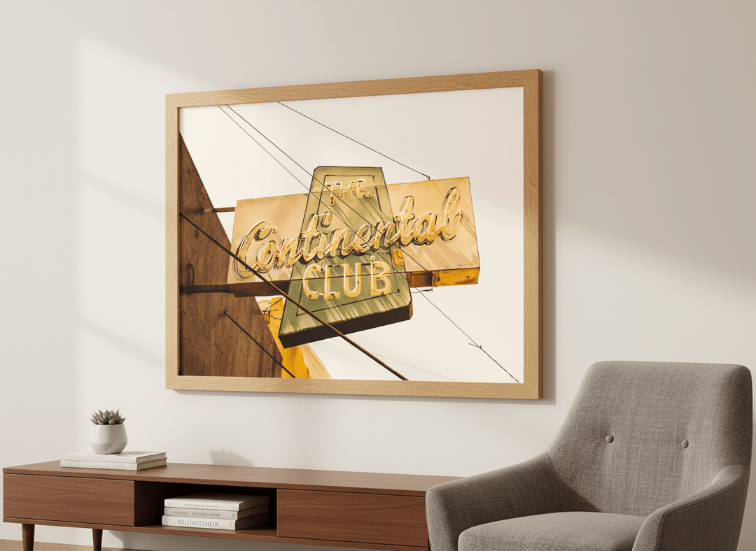 Modern wall art styled above a sofa in a neutral living room