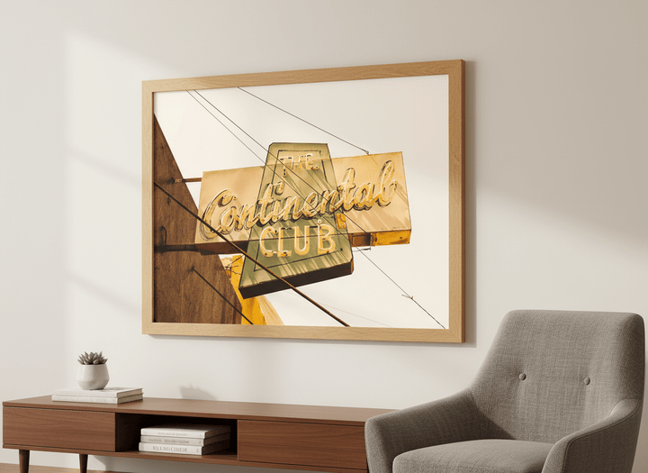 Modern wall art styled above a sofa in a neutral living room