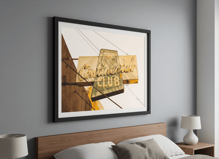 Minimalist artwork displayed in a calm, light-filled bedroom interior