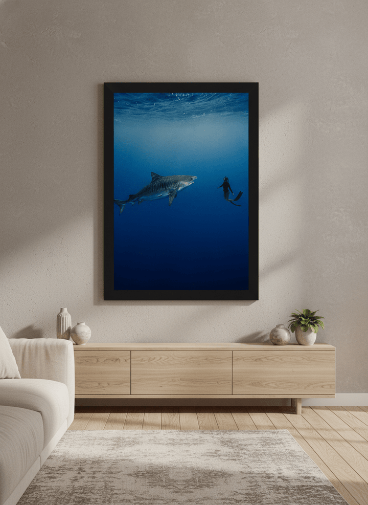 Modern wall art styled above a sofa in a neutral living room