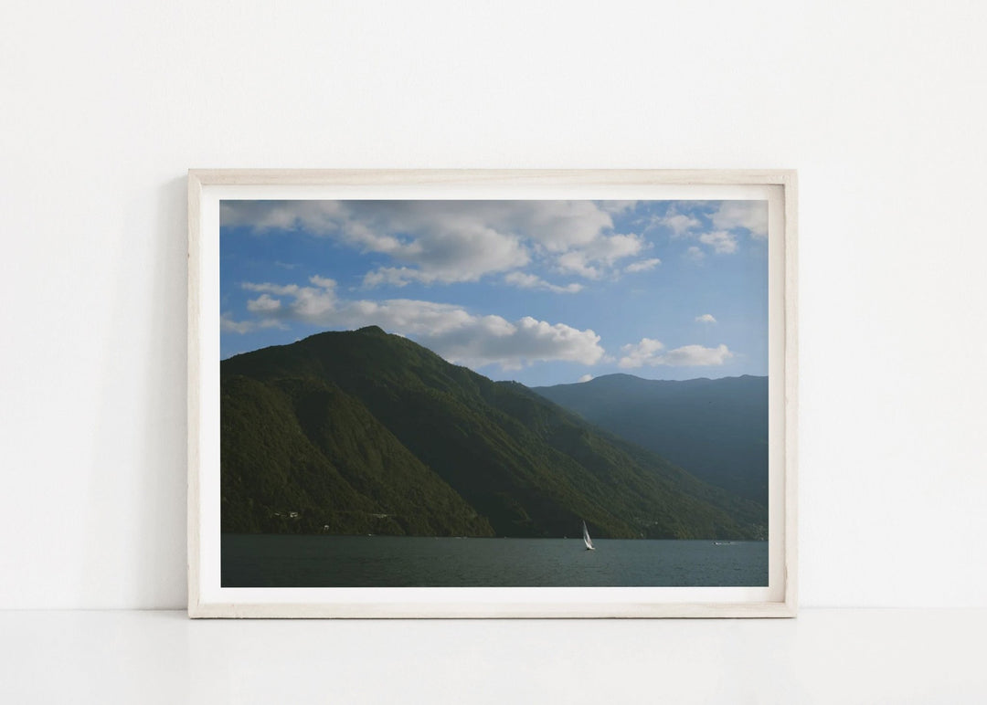 printed photo of mountain leaning against white wall