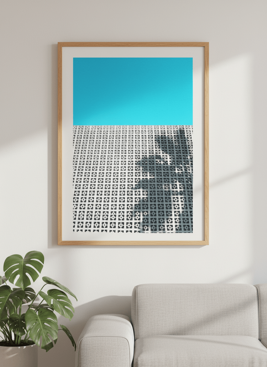 Modern wall art styled above a sofa in a neutral living room