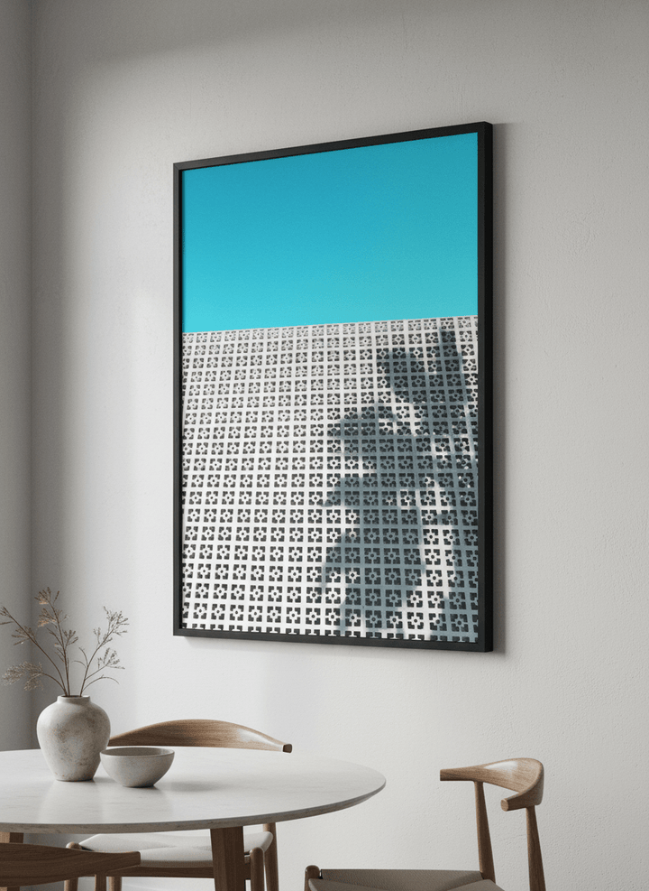 Wall art styled above a dining table in a contemporary home