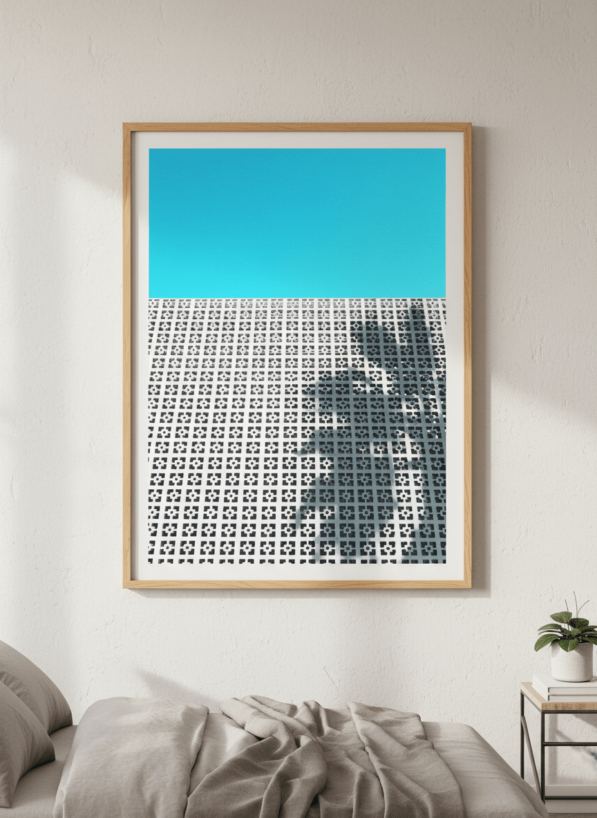 Minimalist artwork displayed in a calm, light-filled bedroom interior
