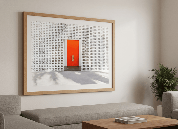 Modern wall art styled above a sofa in a neutral living room