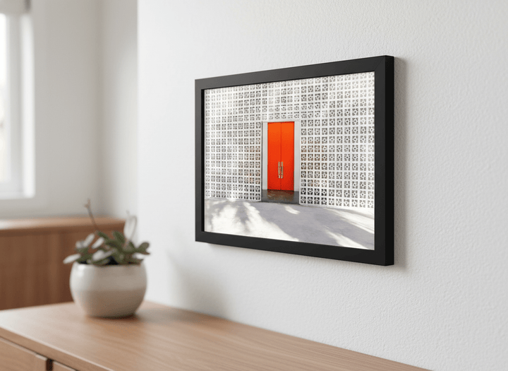 Minimalist artwork displayed in a calm, light-filled bedroom interior