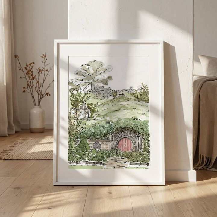 artwork of a landscape with a red door in a room with wooden floor and white walls.