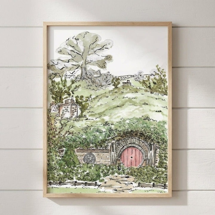 artwork of a hobbit hole and tree on a white wall