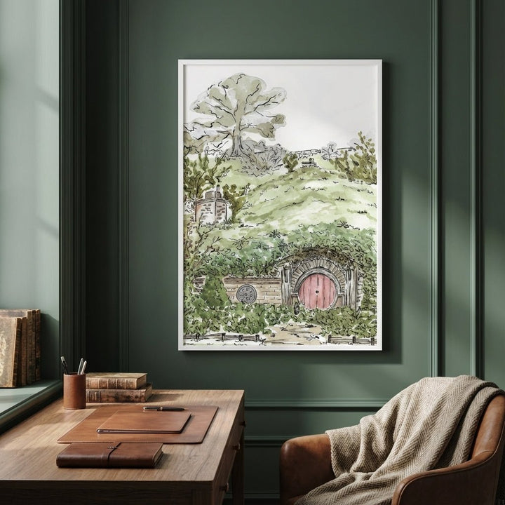 artwork of a hobbit house on a green wall above a wooden desk.